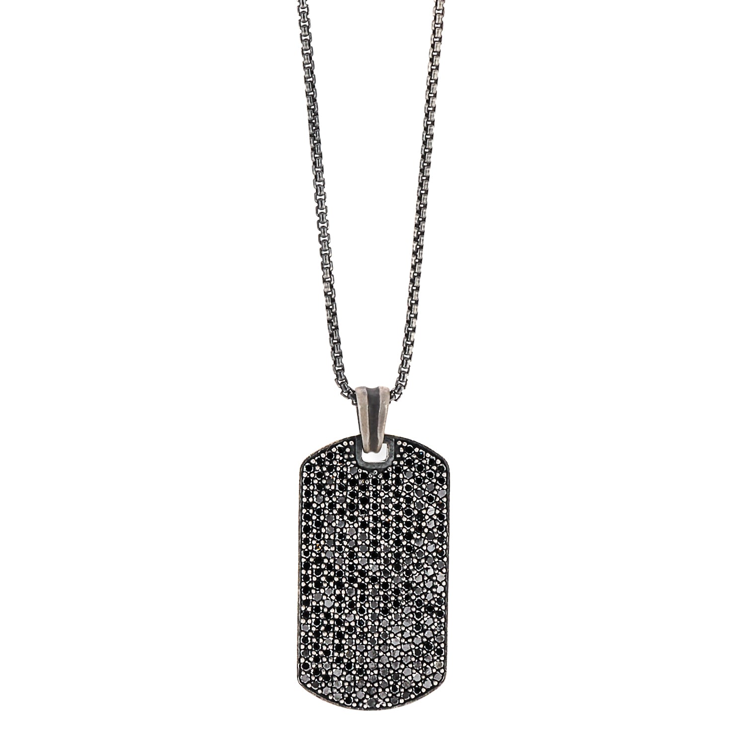 Close-up of the Dog Tag Black Diamond Necklace, showcasing the intricate sterling silver dog tag pendant adorned with a dramatic black pave of diamonds.
