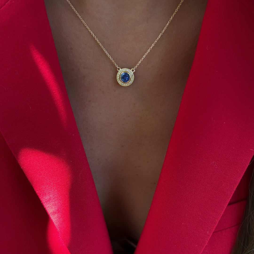 Model wearing the Elegant Sapphire Necklace, radiating grace and sophistication with the captivating sapphire pendant and diamond accents.