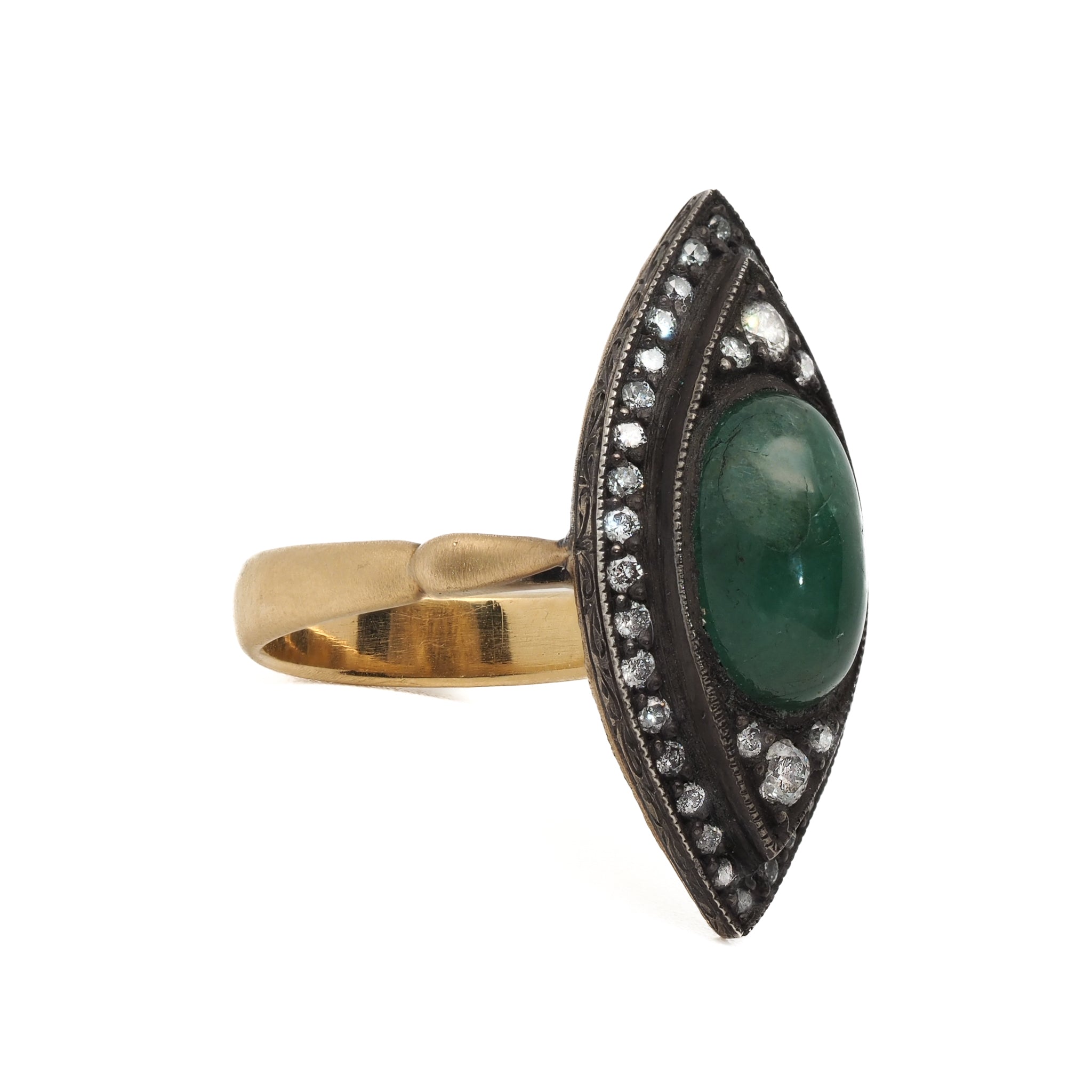 Close-up of the Emerald &amp; Diamond Eye Ring showcasing the vibrant green emerald and the intricate details of the eye-inspired design.