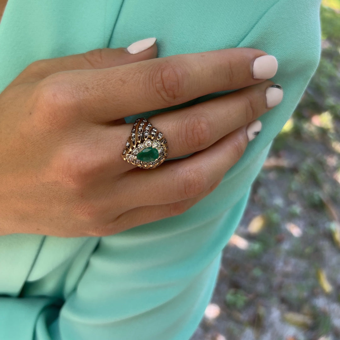 Hand model wearing the exquisite Emerald & Diamond Eye Ring, radiating elegance with its mesmerizing emerald and brilliant diamond accents.