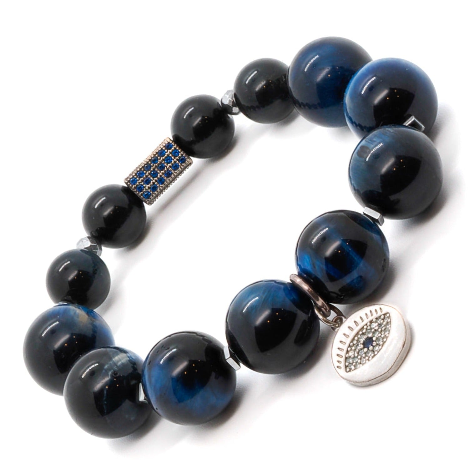 The Power Of Eye Bracelet exudes confidence and style with its Blue Tiger's Eye stone beads and sterling silver evil eye charm.