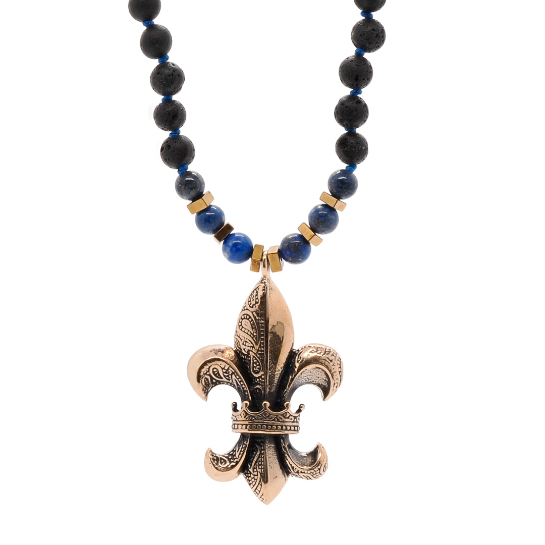 Fleur de Lis Unique Necklace - Handmade jewelry featuring lava rock and lapis lazuli stone beads, and a bronze pendant, symbolizing purity, honor, and spiritual connection