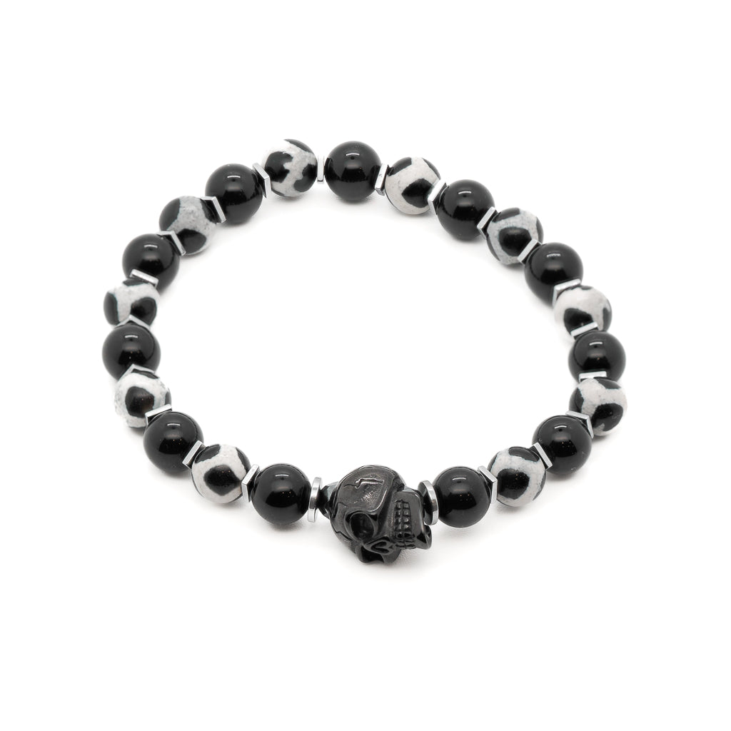 The Gambler&#39;s Lucky Dice Skull Bracelet is a unique and striking piece of jewelry that is perfect for anyone who loves to take risks and live life on the edge. The bracelet features a combination of Black Onyx stone, Nepal agate stone, and a steel black skull accent bead.