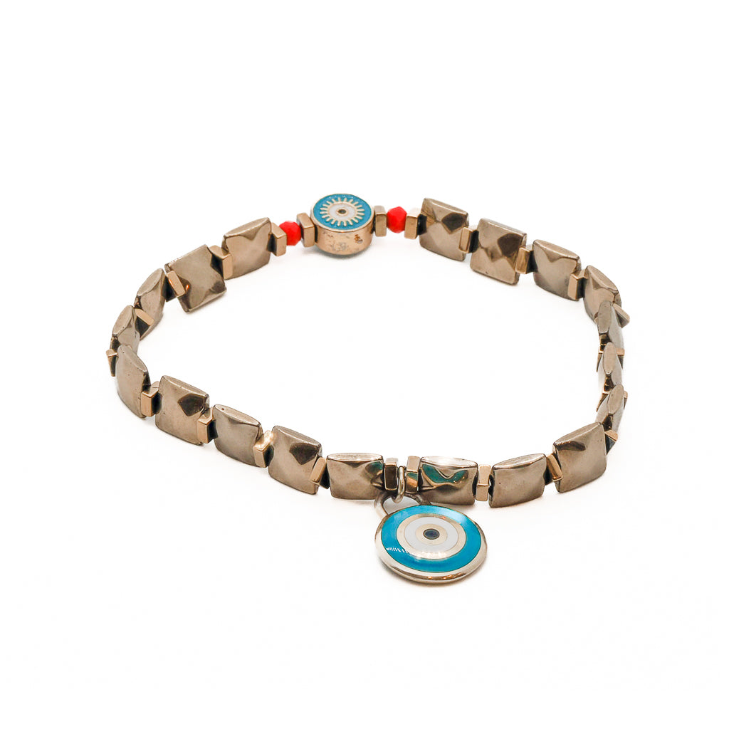 Gold Blue Evil Eye Anklet - A close-up image highlighting the beautiful combination of red crystal beads, gold color hematite stones, and the 925 silver 14k gold vermeil blue and white enamel evil eye charm. The anklet exudes a stylish and protective vibe.