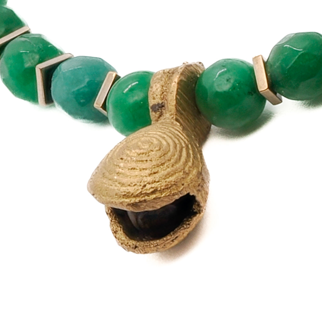 Handcrafted Green Energy Spiral Anklet showcasing a beautiful combination of green jade beads, bronze Nepal spiral charm, and bronze Nepal bell charm, adding a touch of spiritual energy to your everyday style.