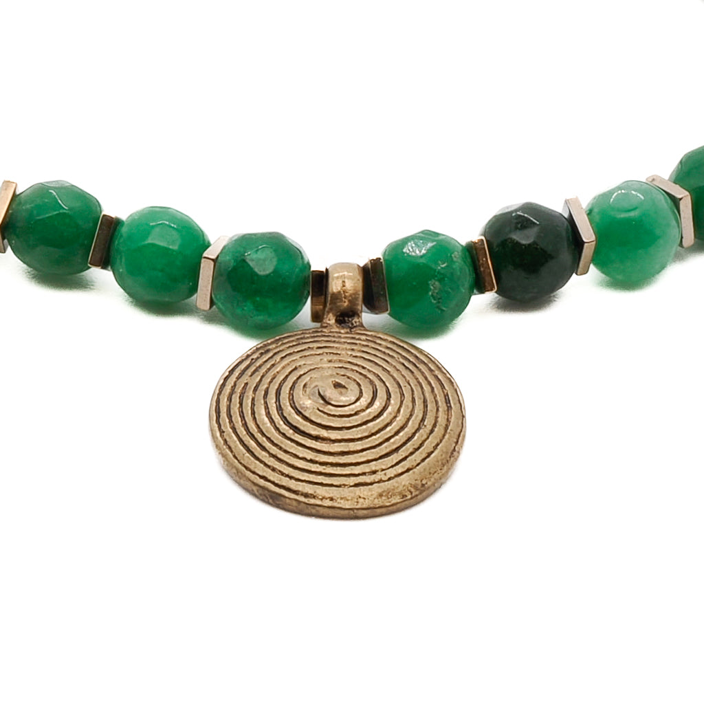 Stylish and meaningful Green Energy Spiral Anklet with bronze Nepal spiral charm, bronze Nepal bell charm, and green jade beads, perfect for meditation and casual wear.