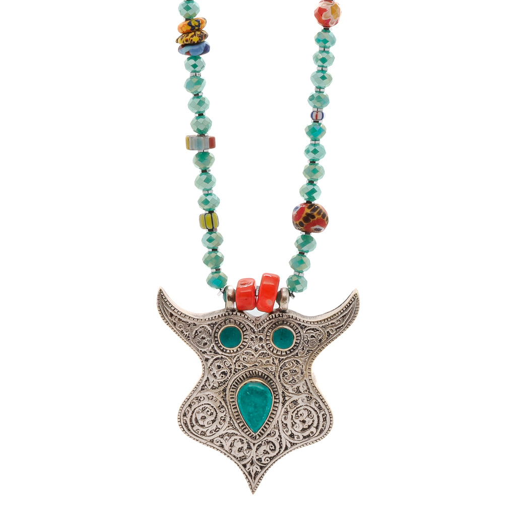 Close-up view of the Happy Spiritual Owl Necklace showcasing the intricate details of the handmade owl pendant, including the turquoise inlay and antique silver finish.