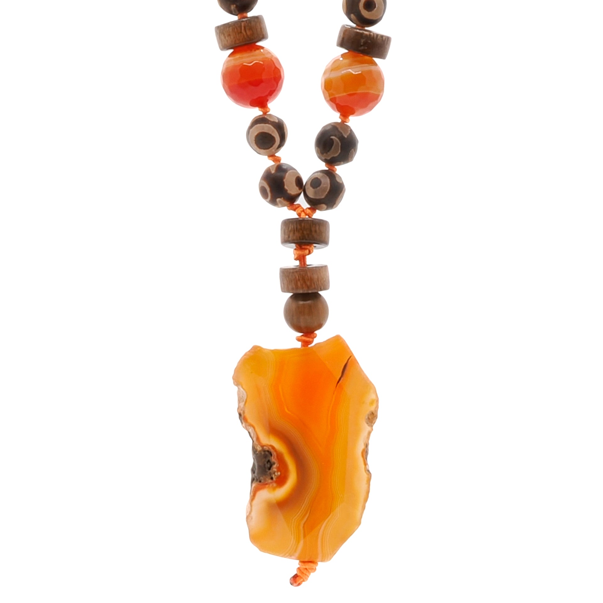 Close-up of the Healing Agate Necklace showcasing the vibrant orange agate pendant and the combination of wooden beads, orange coral, and jasper stones.
