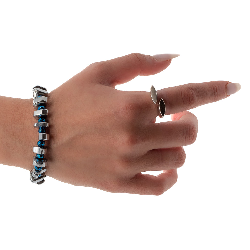 Stylish hand model wearing the Hematite Bracelet, adding a touch of elegance to any ensemble.