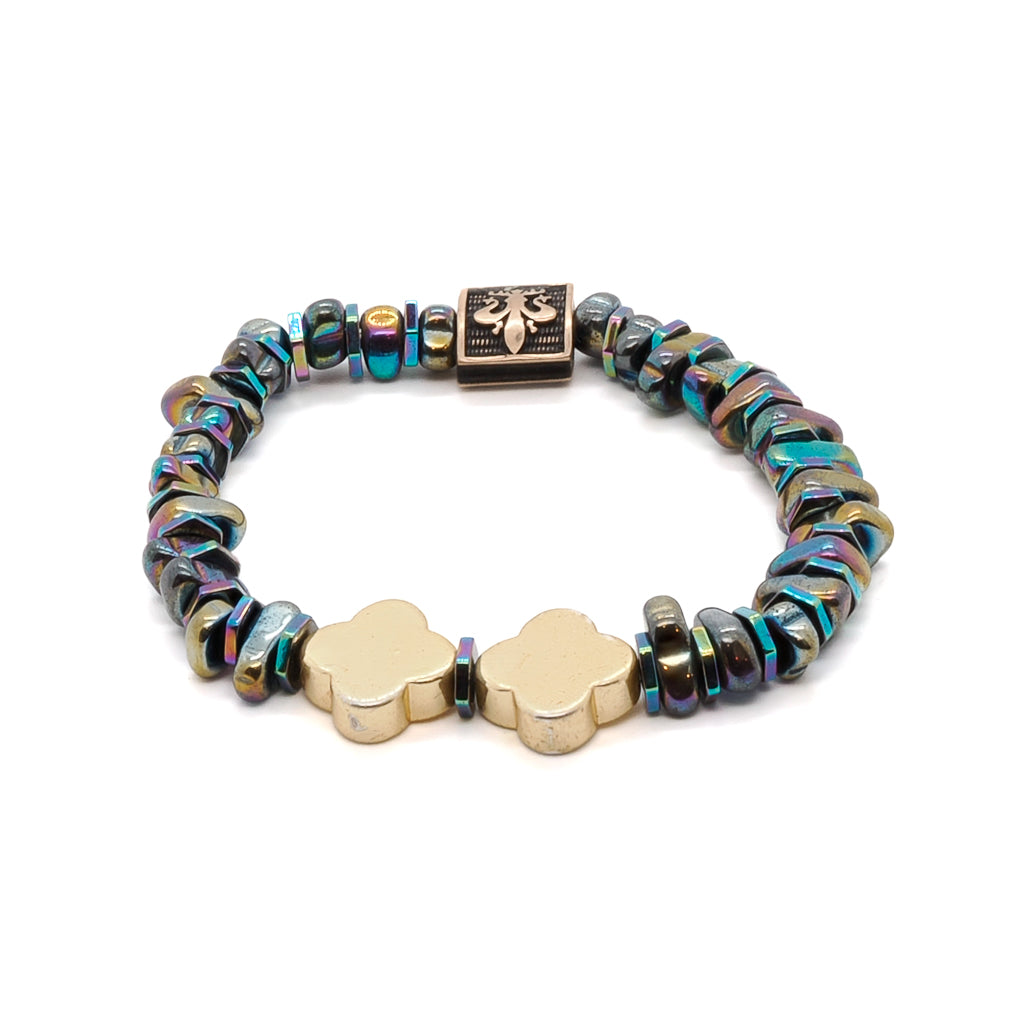 Experience the sophistication of the Hematite Floral Bracelet, adorned with a bronze 18K gold plated Fleur de li bead and vibrant Hematite stones.