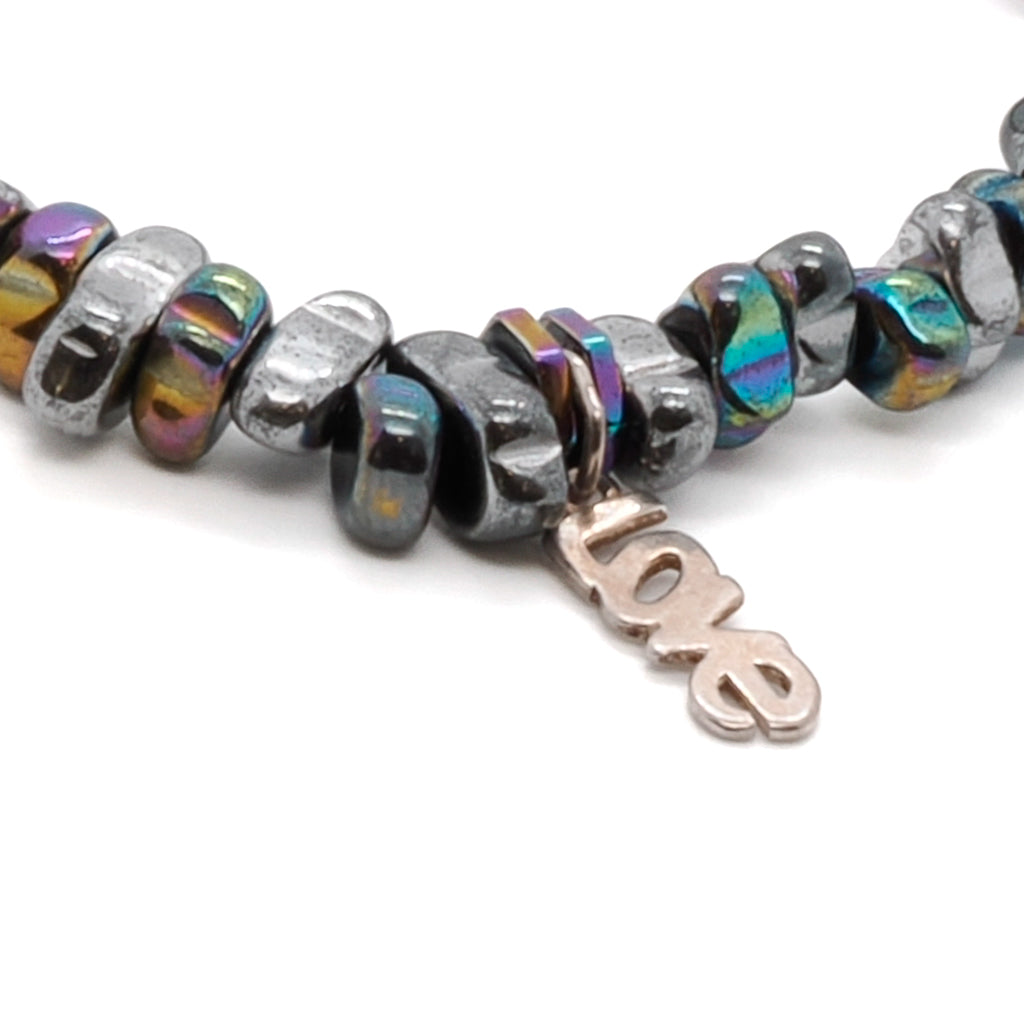 Discover the power of love with the Hematite Love Bracelet, adorned with beautiful hematite beads in various colors.