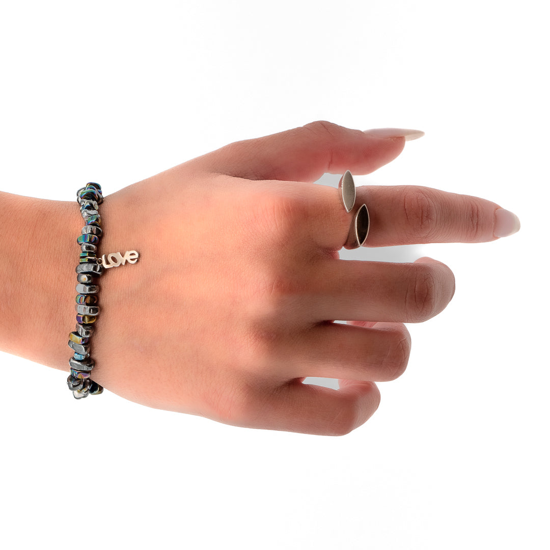 Hand model wearing the Hematite Love Bracelet, showcasing its elegance and meaningful design.