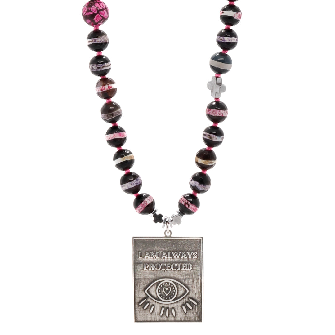 The I Am Always Protected Necklace, featuring Nepal Agate stone beads and a sterling silver Evil Eye pendant.