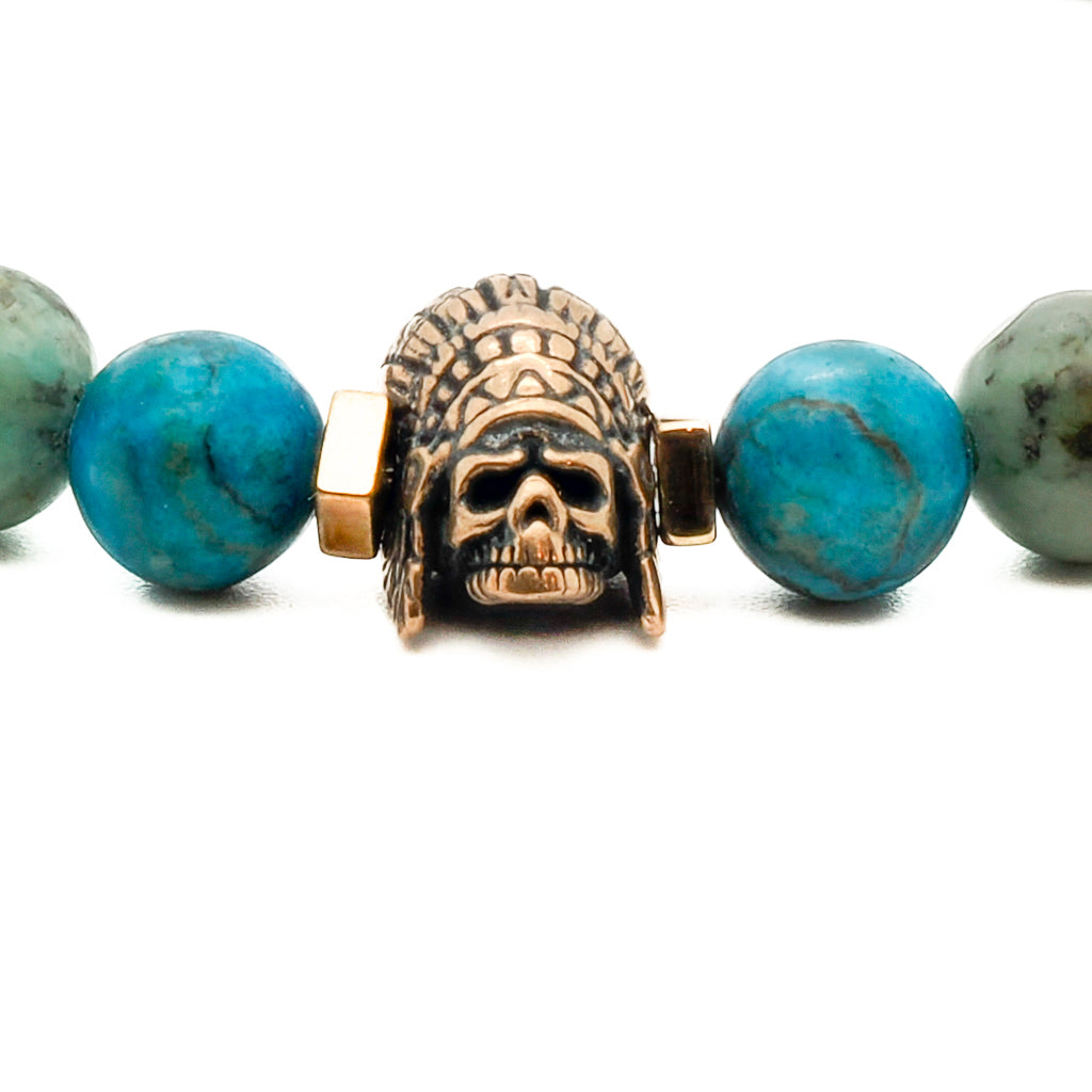 Detailed shot of the bronze gold-plated Indian accent bead on the Indian Men Bracelet, showcasing its intricate design.
