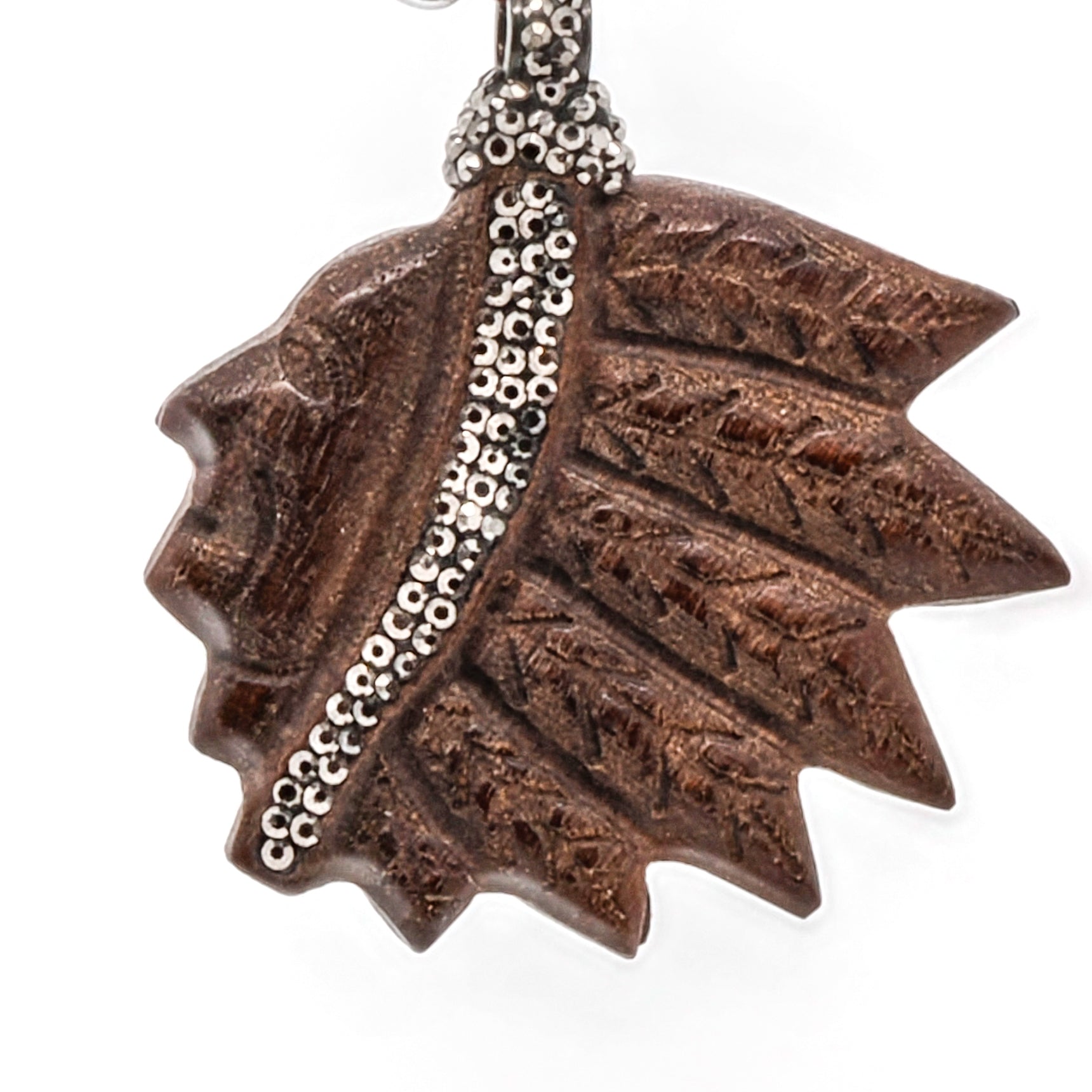 The engraved wood Indian chief pendant adds a touch of cultural significance to the necklace, with its intricate detailing and symbolic meaning.