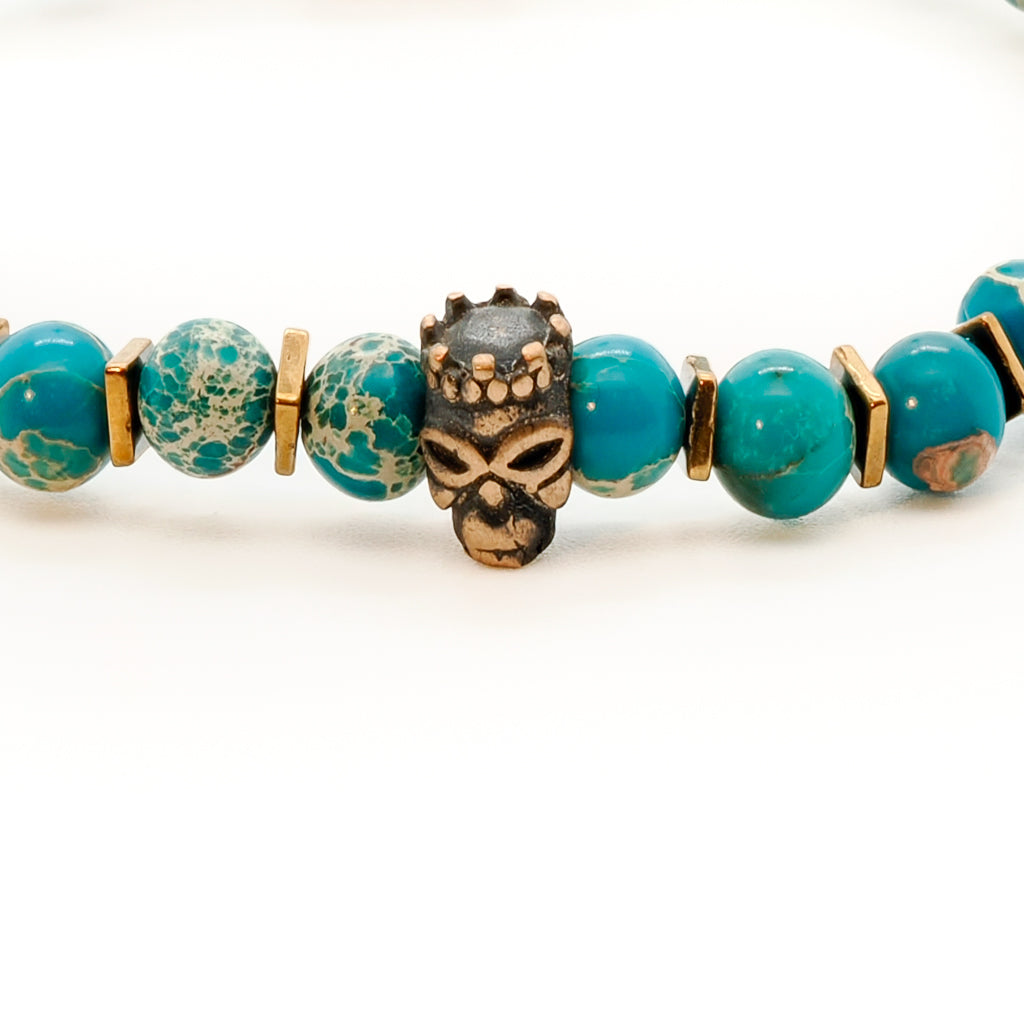 the Inner Harmony Bracelet, displaying the bronze gold-plated Fleur de lis accent bead.
