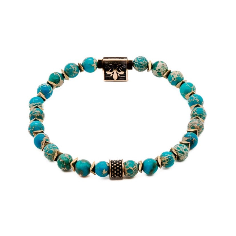 The Inner Peace Men&#39;s Bracelet featuring Blue Variscite stone beads and a symbolic Bronze gold-plated Fleur de lis accent bead.