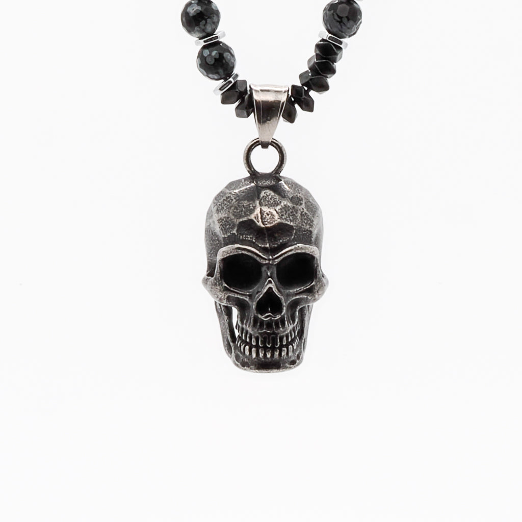 The Inner Power Skull Necklace featuring Hematite and Obsidian Snowflake stone beads with a handmade Steel Skull Pendant.