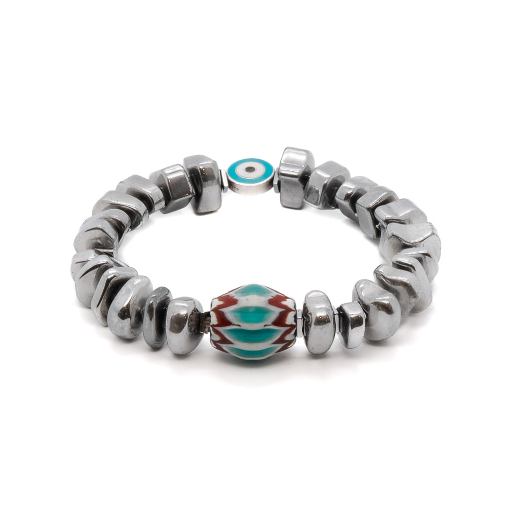 The Juno Bracelet, a harmonious blend of elegance and spiritual meaning, featuring silver nugget hematite stone beads and a handmade Turquoise and Red Nepal bead.