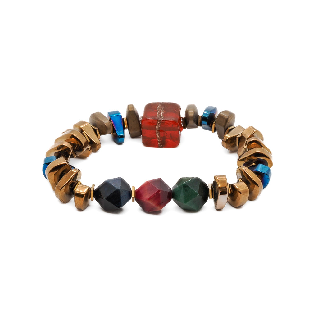 The Karma Hematite Bracelet, featuring a central 3-color jasper stone surrounded by gold and blue hematite beads, exuding elegance and balance.