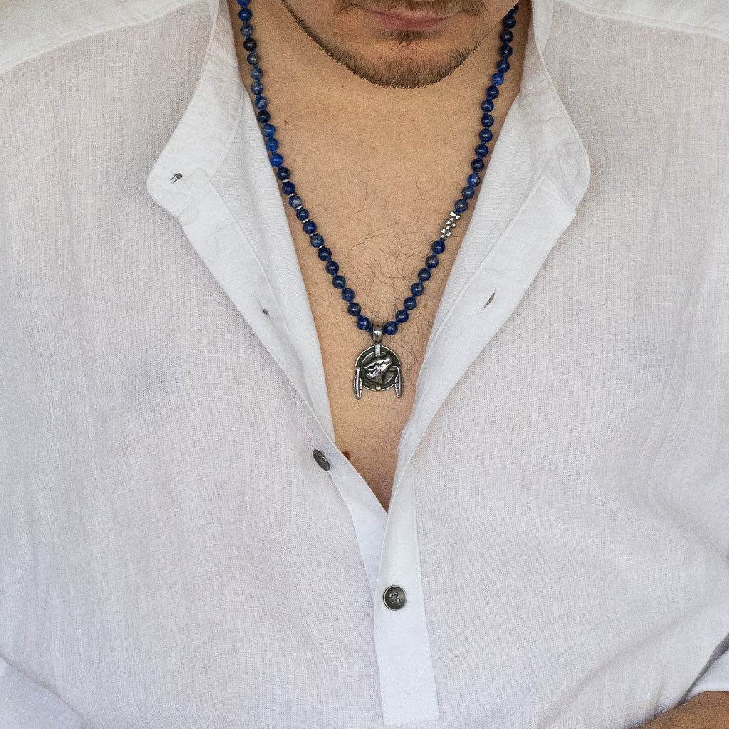 Model wearing the Lapis Lazuli Brave Wolf Necklace, showcasing its bold design and expressing their wild side.
