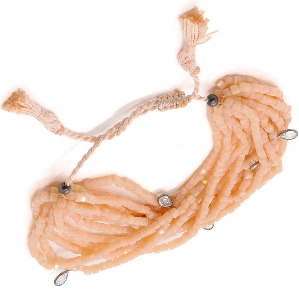 Stunning Lia Bracelet with adjustable size and vibrant pinkish orange crystal beads.