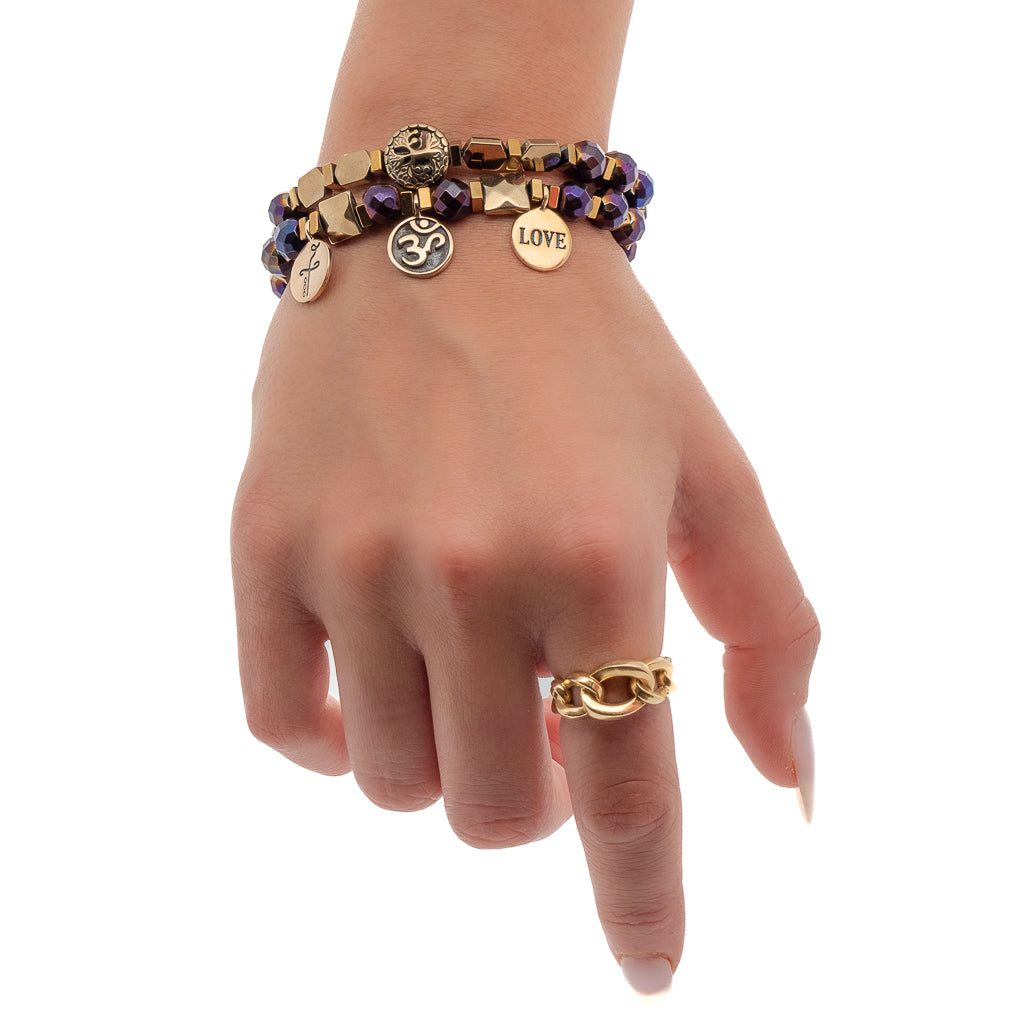 Hand model wearing the Life Journey Bracelet Set, showcasing its elegant style and meaningful charms.