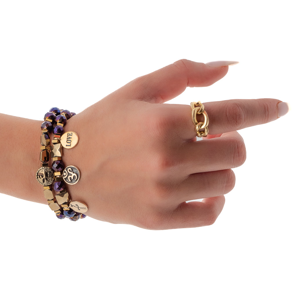 The bracelet set adorning the wrist of a hand model, radiating positive energy and capturing attention with its beautiful design.