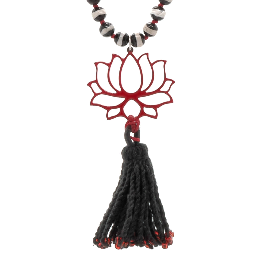 Find spiritual elegance with the Lotus Flower Necklace, showcasing a handcrafted tassel and intricate Nepal agate stone beads.