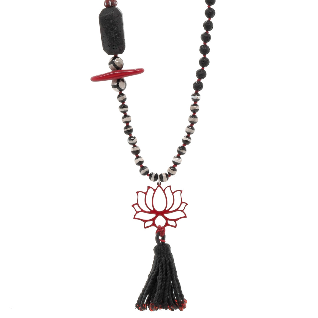 Adorn yourself with the beauty of the Lotus Flower Necklace, featuring black lava rock stone beads and a vibrant red enamel lotus pendant.