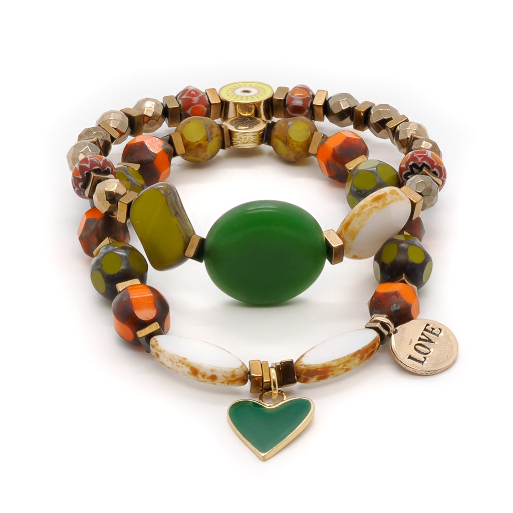 Experience the vibrant beauty of the Love African Bracelet Set, showcasing geometric African beads and captivating charms.