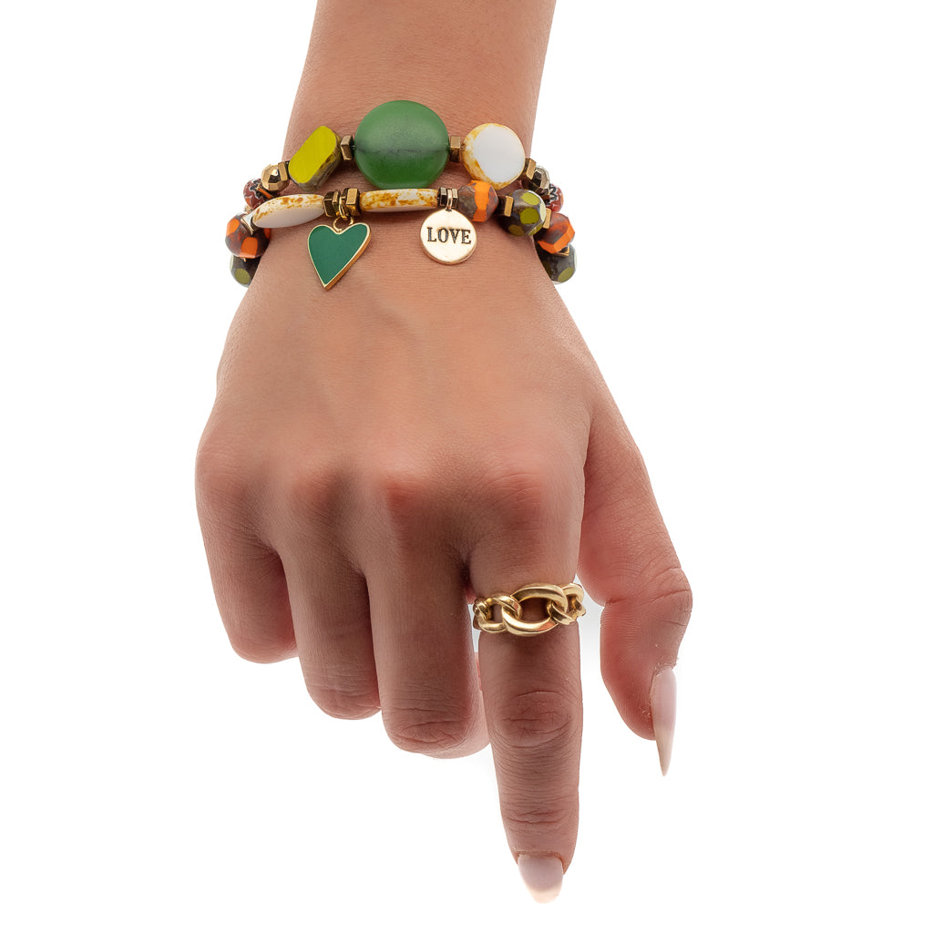Experience the vibrant beauty of the Love African Bracelet Set, as our model showcases its captivating beads and symbolic charms.