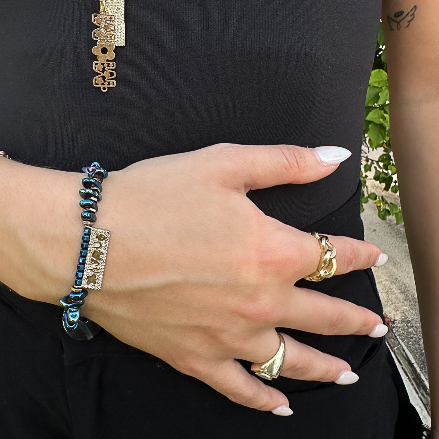See how the Protection & Luck Blue Hematite Bracelet adorns the hand model's wrist, combining style and spiritual significance.