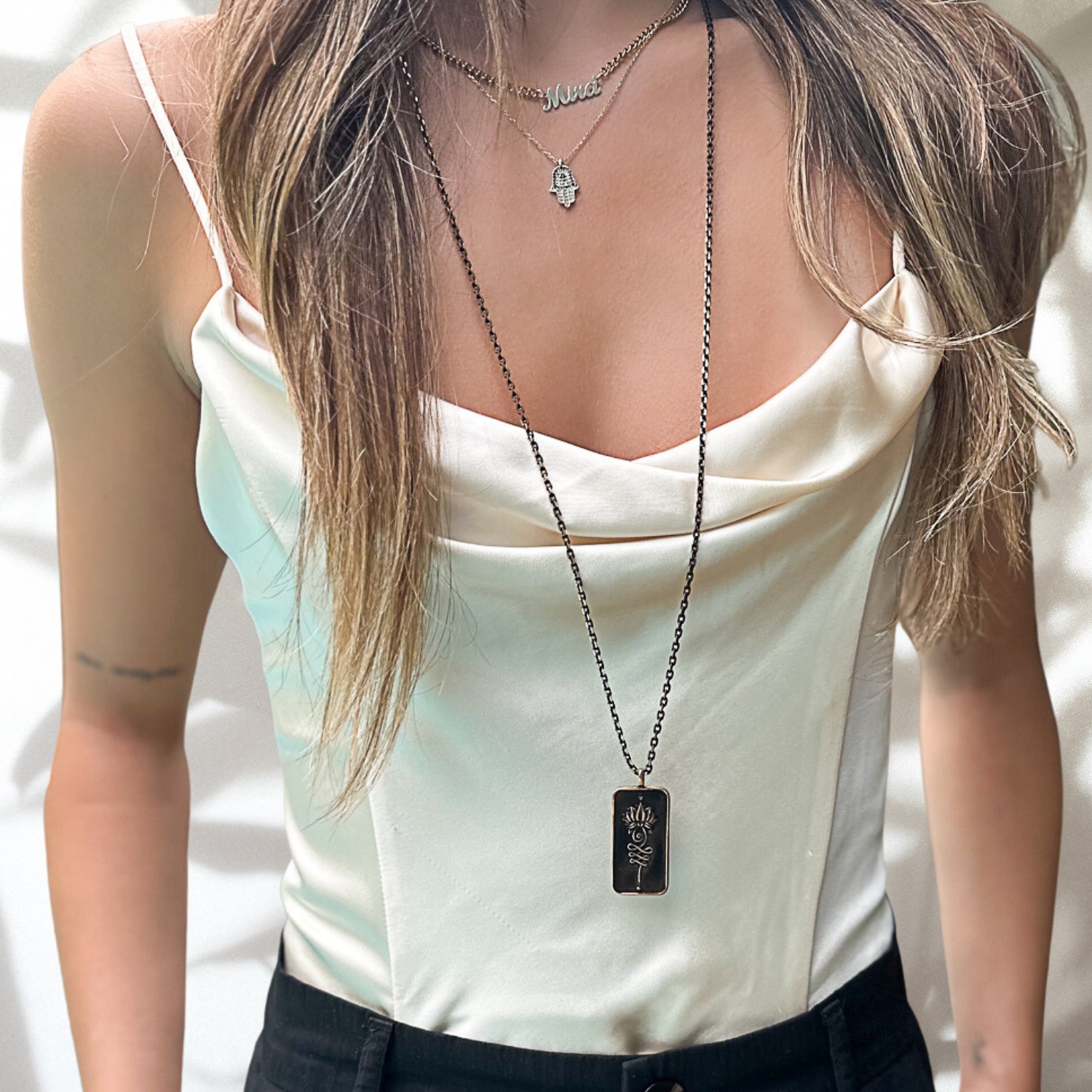 See how the Love Yourself Unalome Necklace beautifully complements our model's style, radiating self-love and confidence.