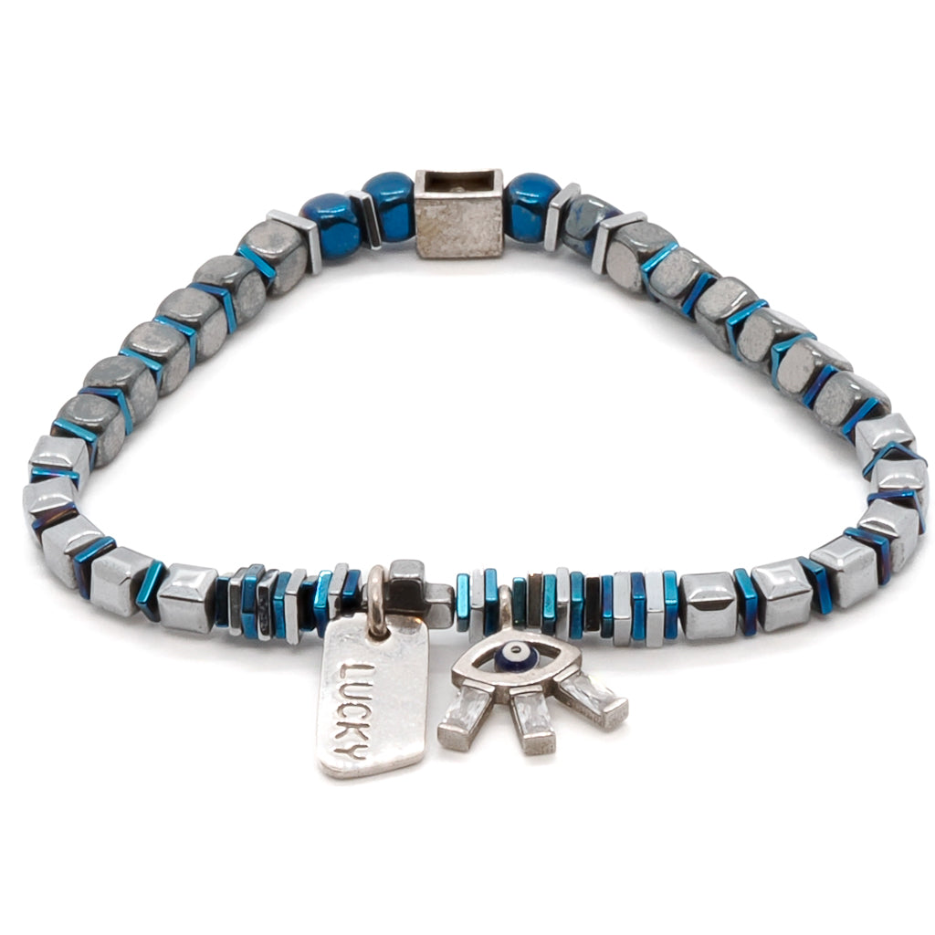 Adorn your wrist with the enchanting Lucy Evil Eye Bracelet, a handmade accessory showcasing blue and silver hematite beads and a striking 925 sterling silver evil eye charm with sparkling Swarovski crystals.