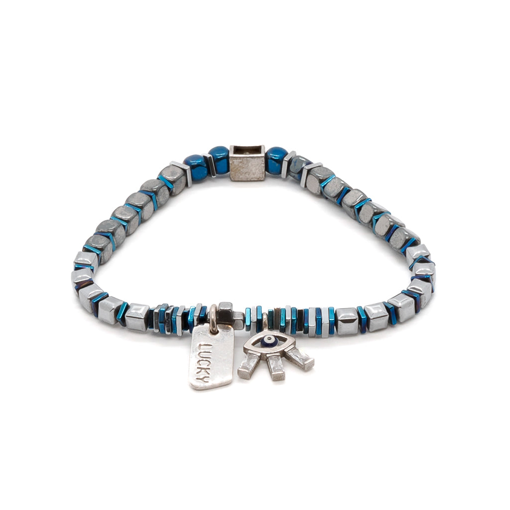 Embrace the captivating beauty of the Lucy Evil Eye Bracelet, featuring blue and silver hematite beads and a stunning 925 sterling silver evil eye charm with Swarovski crystals.