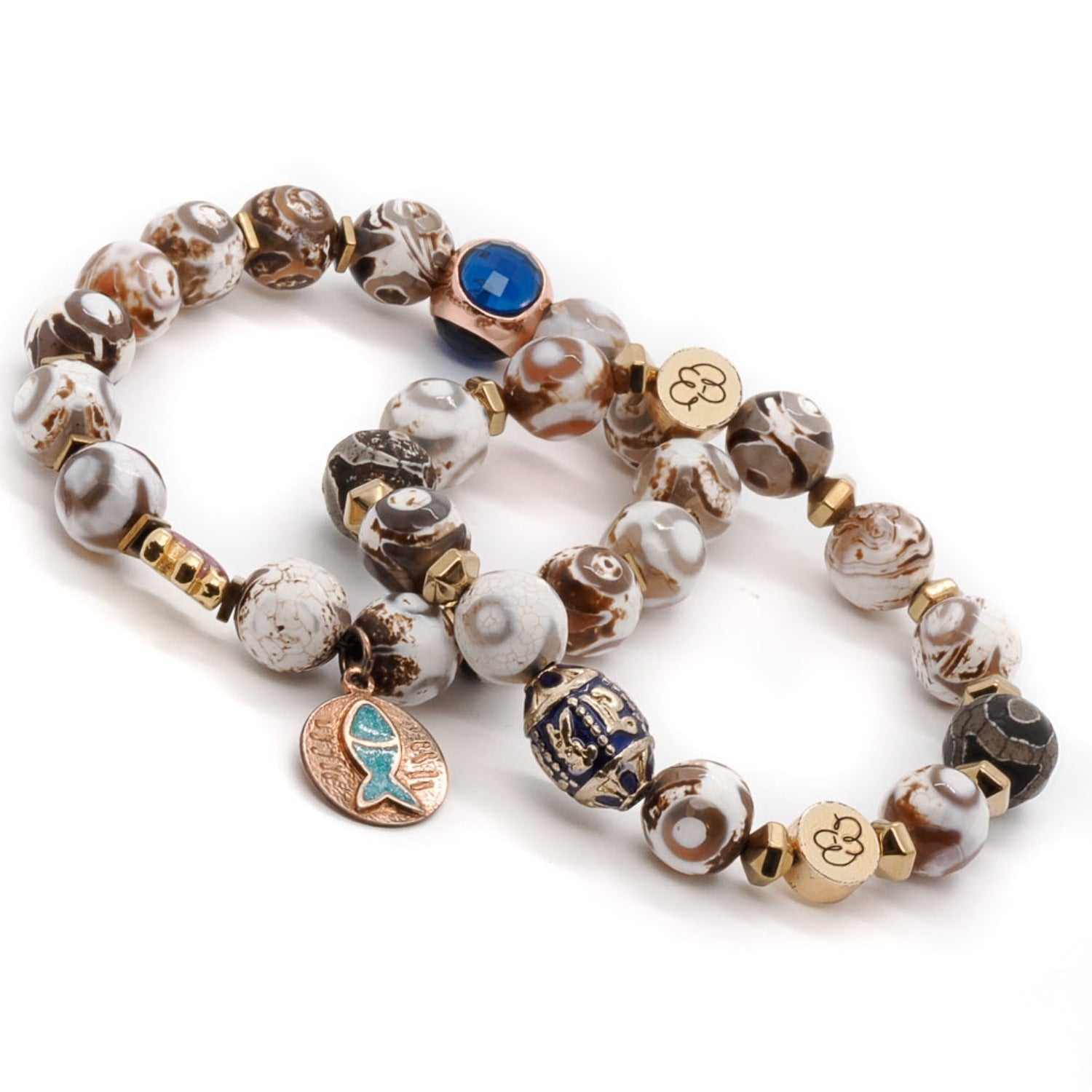 Discover the captivating beauty of the Lucky Fish Bracelet Set, handmade with Tibetan agate beads, gold hematite, and adorned with a gold-plated purple elephant and a sterling silver on gold-plated blue enamel fish charm.