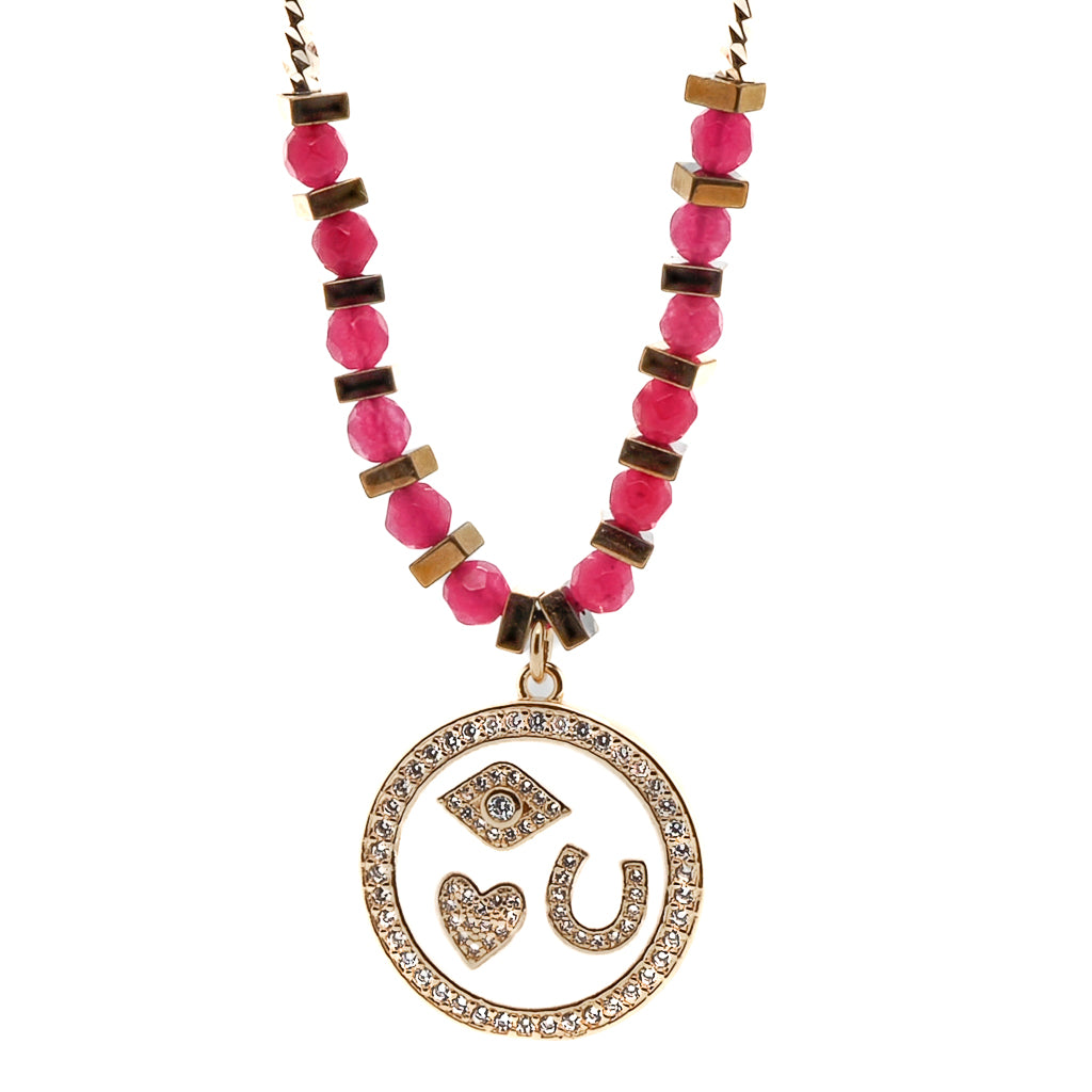 Embrace the magic of symbols with the Magic Blessings Pink Necklace, featuring an evil eye, horseshoe, heart pendant, and lucky flowers, handcrafted with hot pink faceted jade stone beads and gold-colored hematite spacers.
