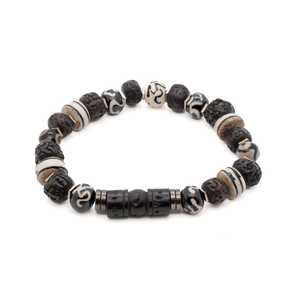 Embrace inner peace with the Meditation Yoga Bracelet, featuring Om Nepal yak bone beads and eye meditation beads.