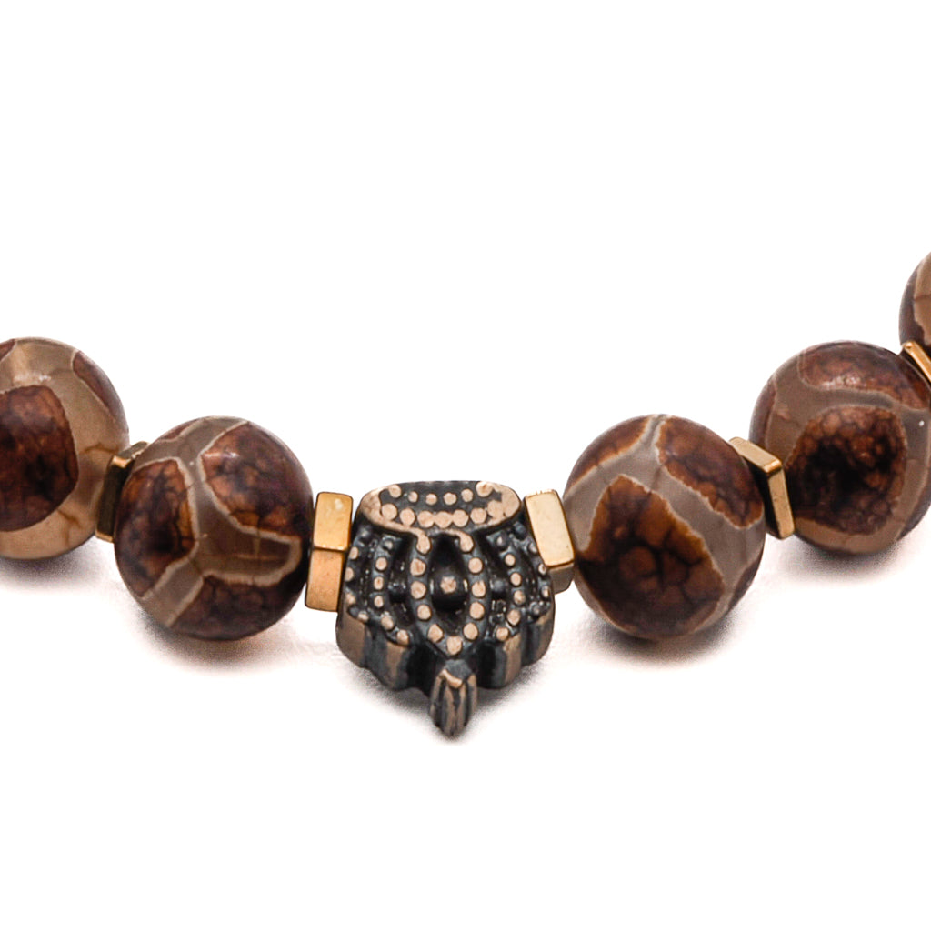 Witness the powerful symbolism of the Men&#39;s Spiritual Beaded King Crown Bracelet, showcasing a bronze crown accent bead.