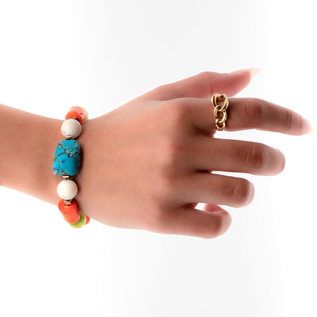 Enhance your style with the vibrant colors of the Mila Bracelet, as seen on the model.