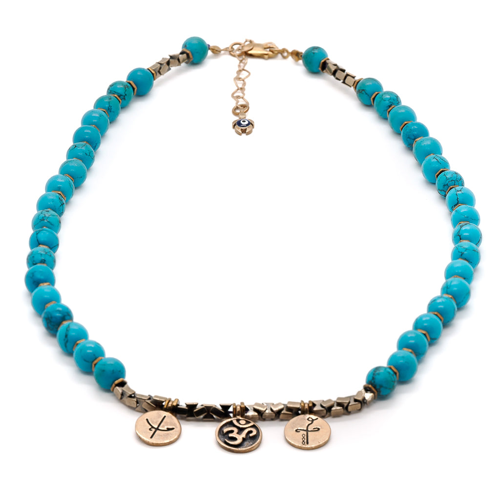Turquoise stone beads and hematite spacers of the Mystic Meditation Necklace.