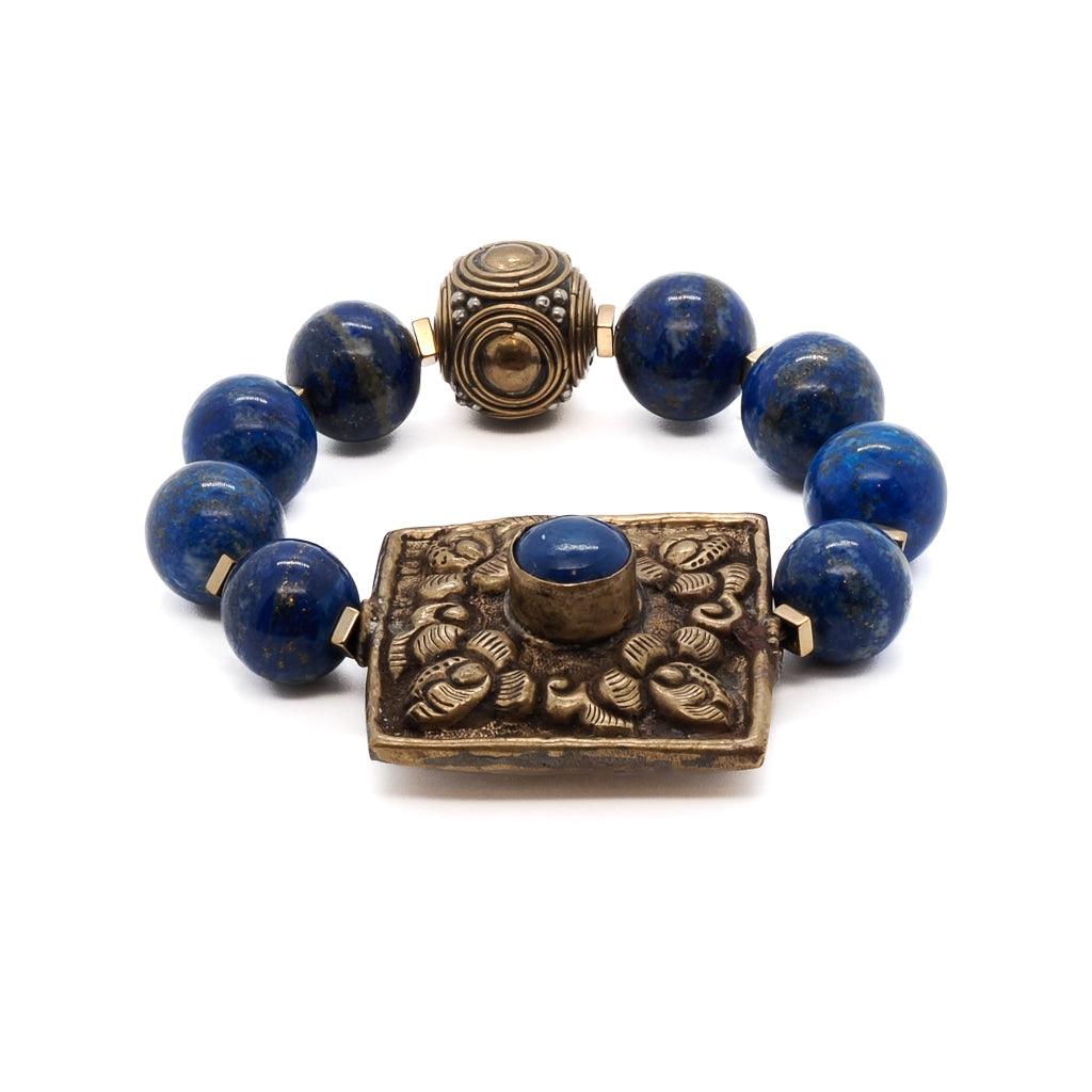 Embrace the beauty and uniqueness of the Nepal Energy Bracelet, featuring lapis lazuli beads and a stunning Nepalese brass piece.