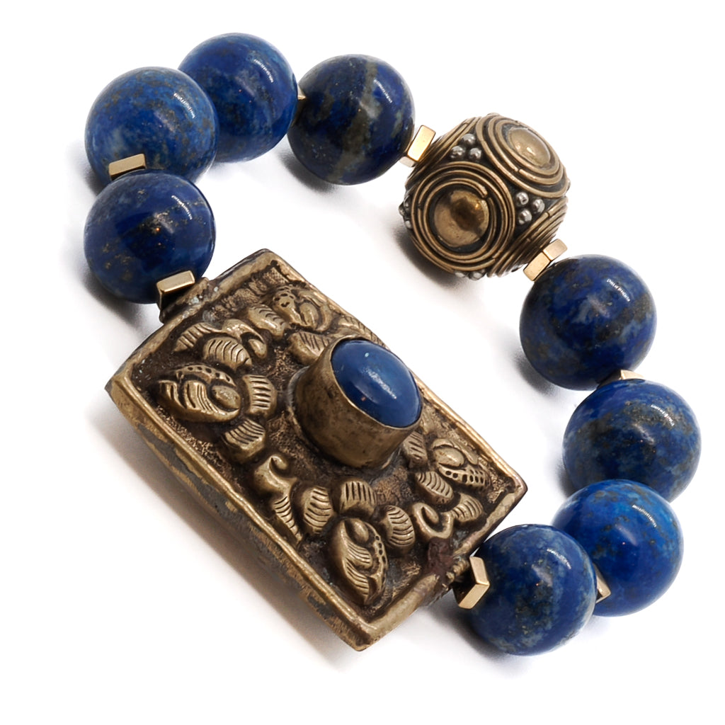 Discover inner peace and self-awareness with the Nepal Energy Bracelet, adorned with lapis lazuli beads and gold color hematite spacers.