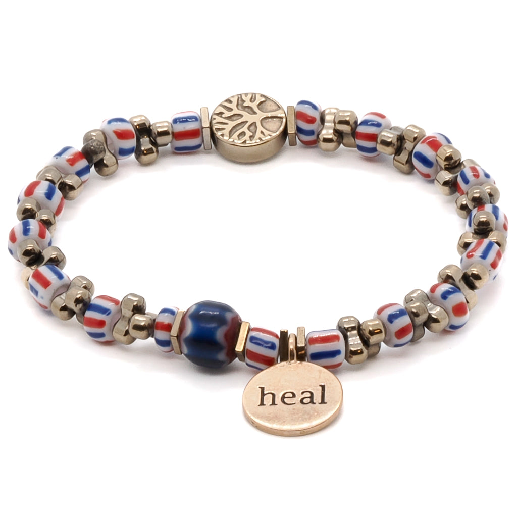 Show off your spiritual side with the Nepal Heal Bracelet, featuring a striking tree of life bead and a bronze heal charm.