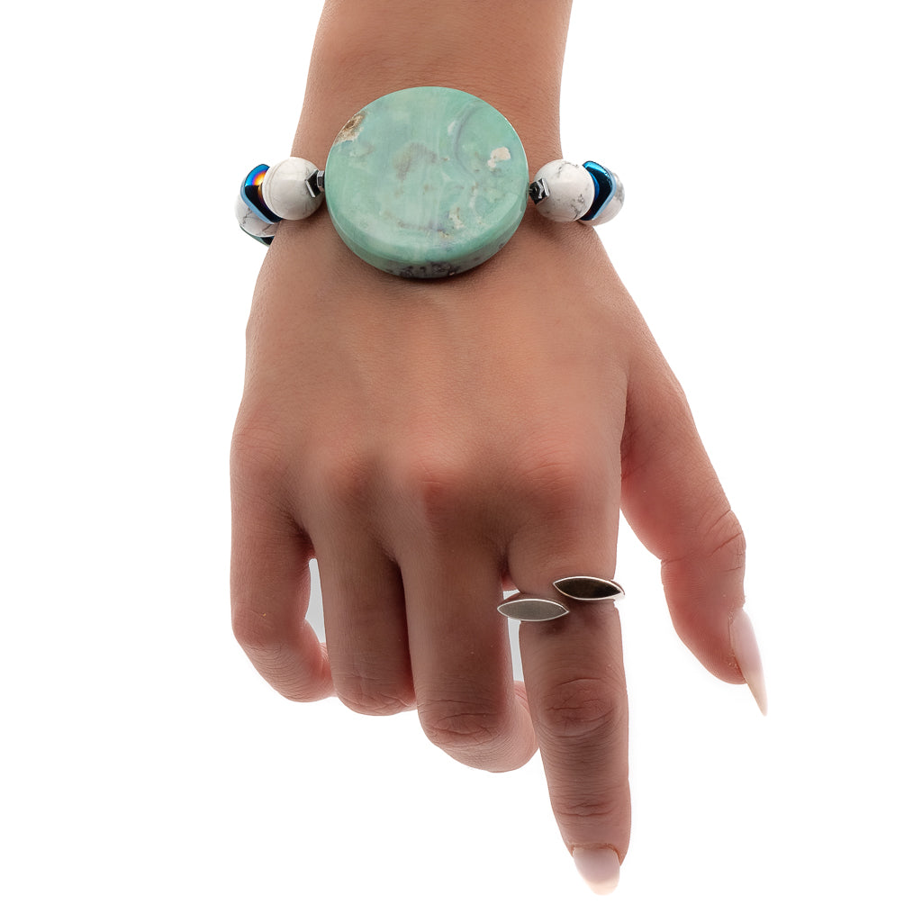 See how the Ocean Bracelet enhances the hand model's look with its unique design and calming energies.