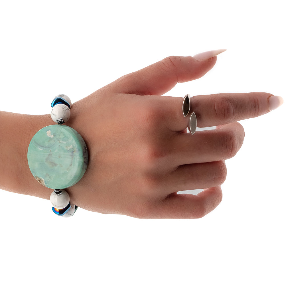 Hand model showcases the serene beauty of the Ocean Bracelet, highlighting the ocean jasper stone and white howlite beads.