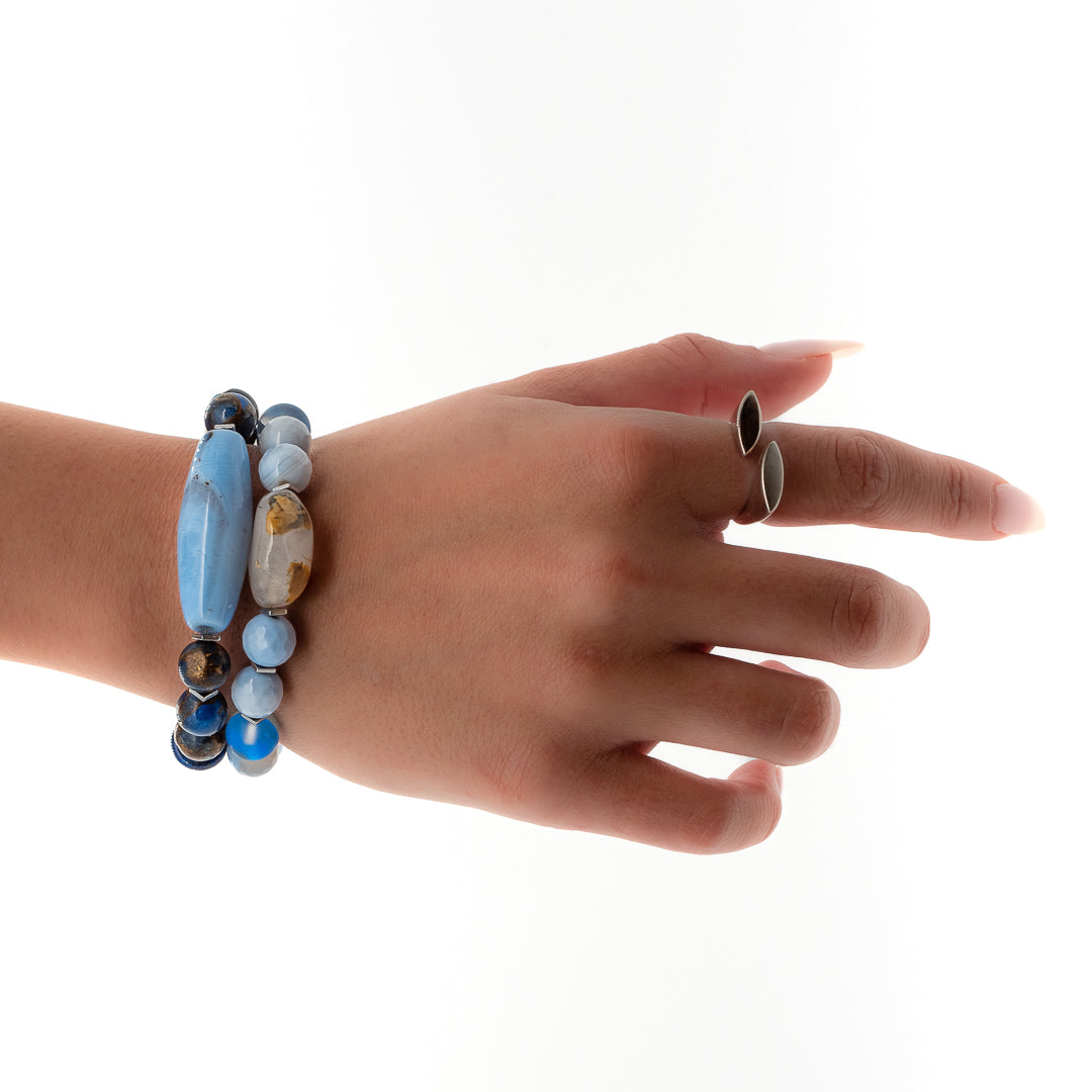Hand model showcases the elegance of the Ocean Inner Peace Bracelet Set, capturing the essence of calm and serenity.