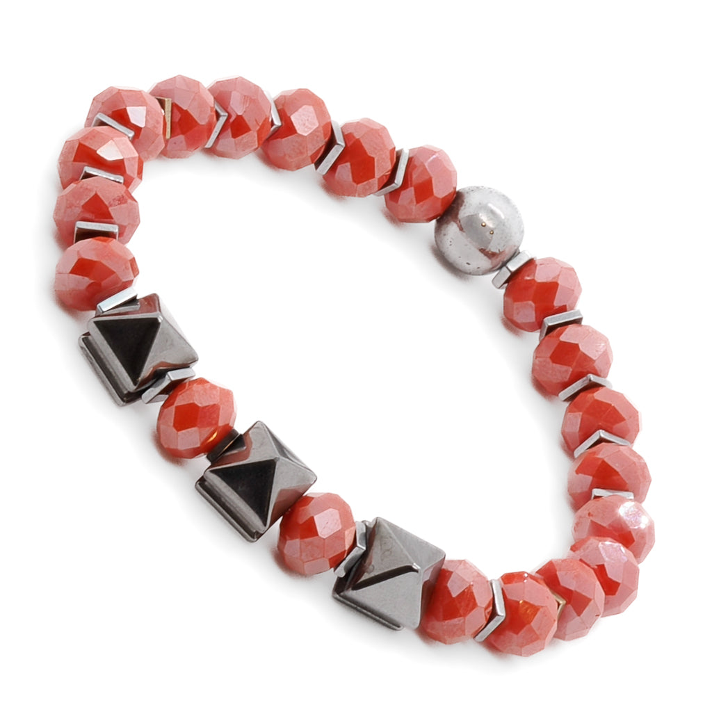 Adorn your wrist with the uplifting Orange Energy Bracelet, featuring orange crystal beads and silver hematite stone beads.