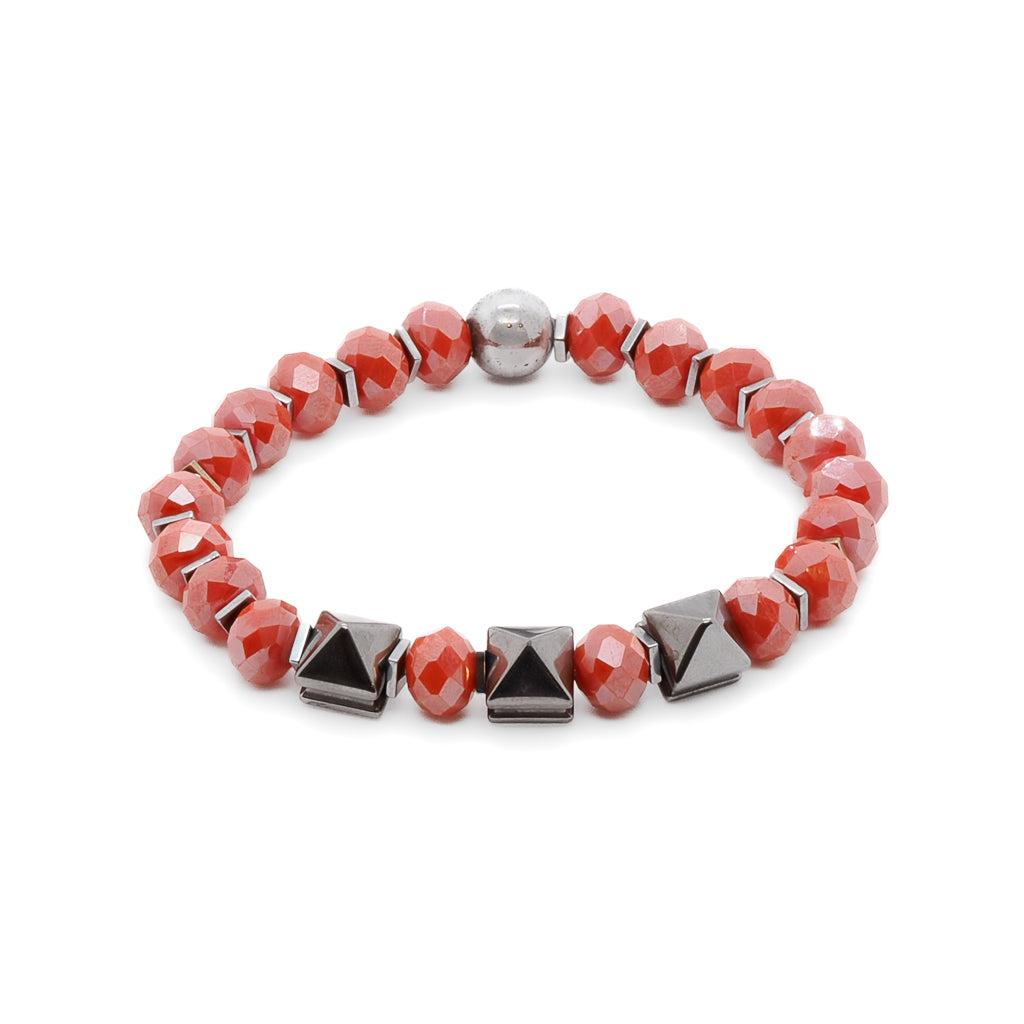Experience the vibrant energy of the Orange Energy Bracelet, adorned with orange crystal beads and silver hematite stone beads.